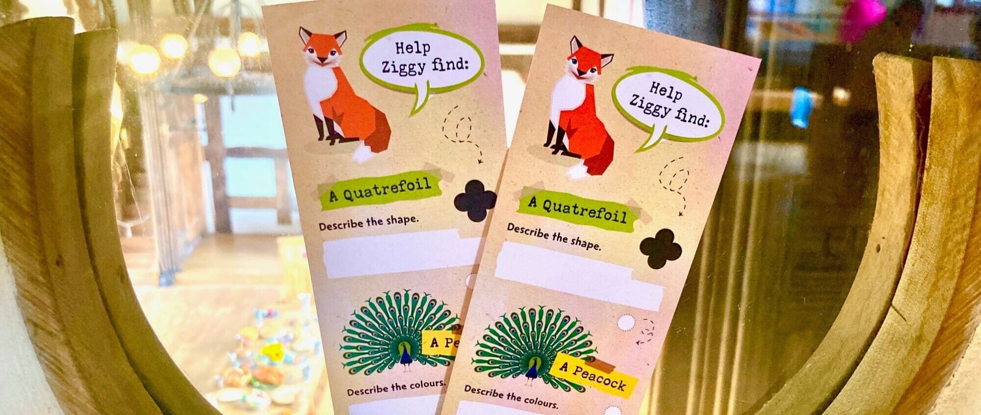 Two bookmarks sit in the base of a quatrefoil window.