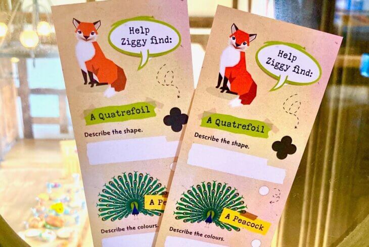 Two bookmarks sit in the base of a quatrefoil window.