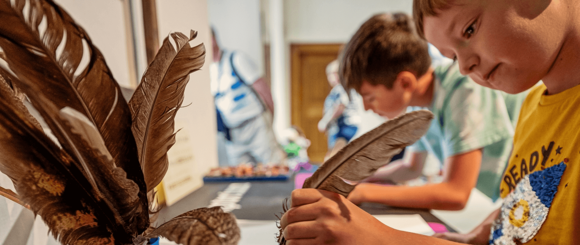 Child writing with a quill pen