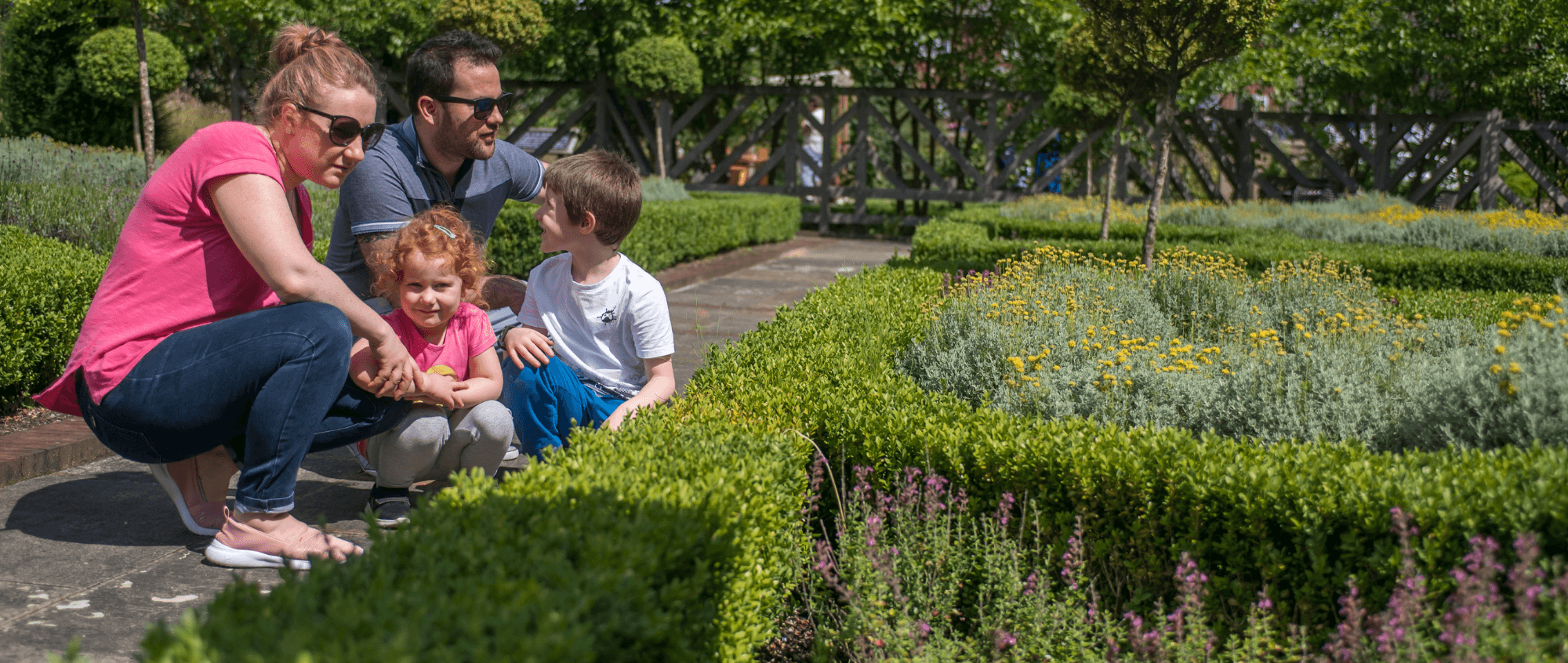 Family in gardens