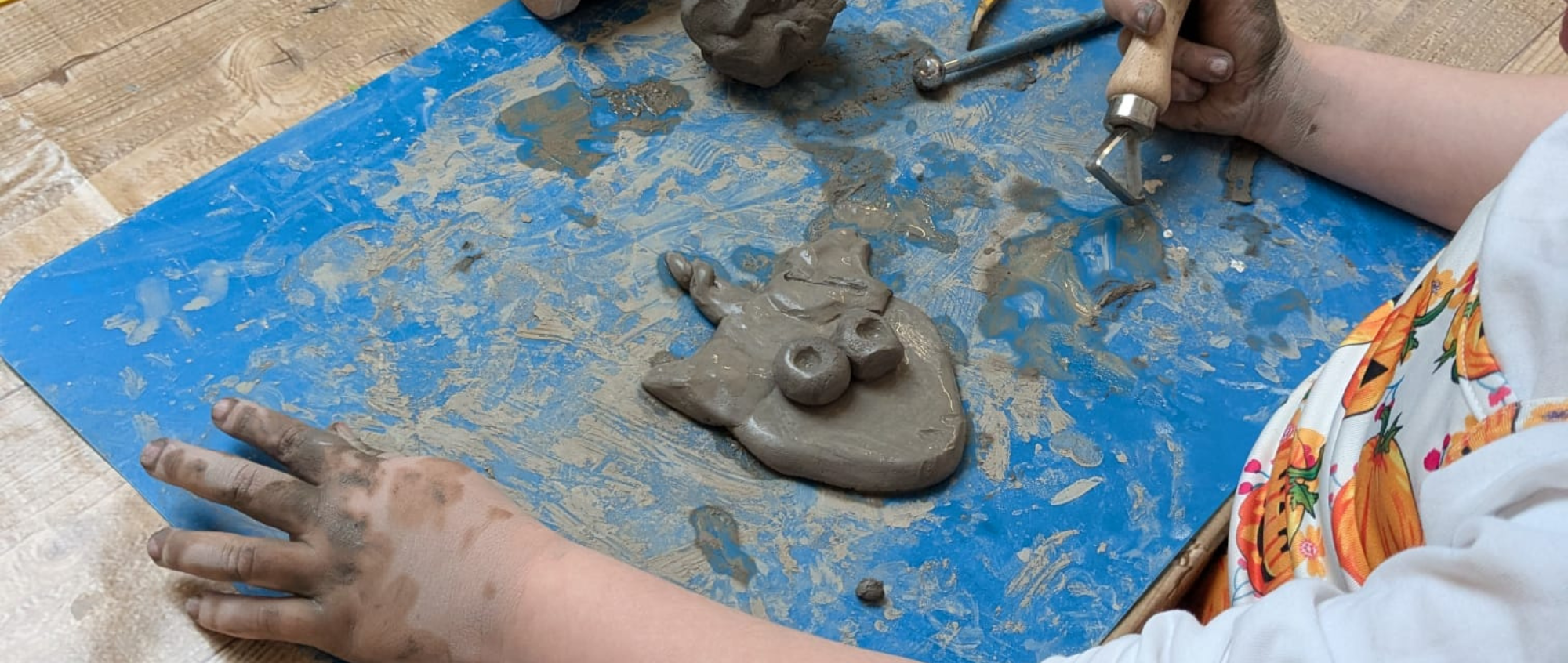 Child playing with clay