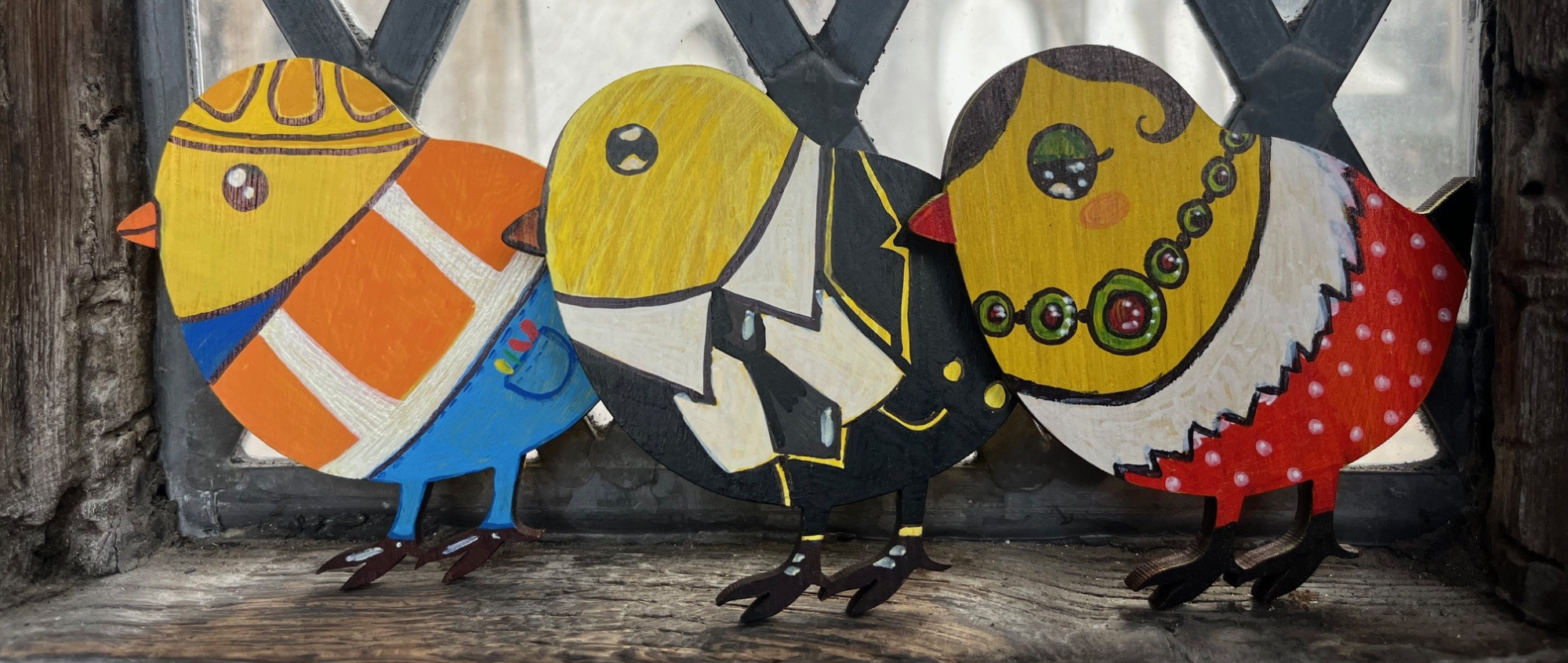 A row of three chicks